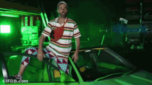 Man In Striped Shirt Sitting In Green Car With Green Light GIF