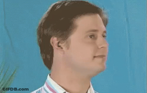 Man In Striped Shirt Smiling Blue Background GIF