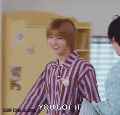 Man In Striped Shirt Smiling Next To Another Man GIF