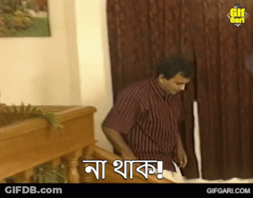 Man In Striped Shirt Standing With Gifgari.com Sign GIF