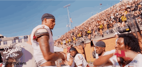 Man In Striped Shirt Talking To Man In Blue Shirt GIF