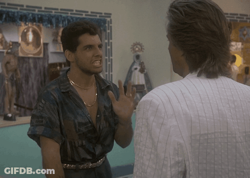 Man In Striped Shirt Talking To Man In Blue Shirt GIF