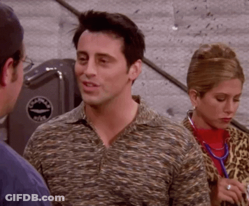 Man In Striped Shirt Talking To Woman In Leopard Print Coat GIF