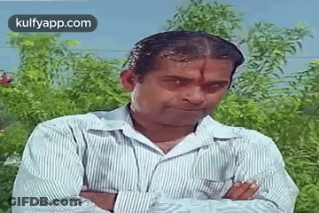Man In Striped Shirt With Arms Crossed GIF