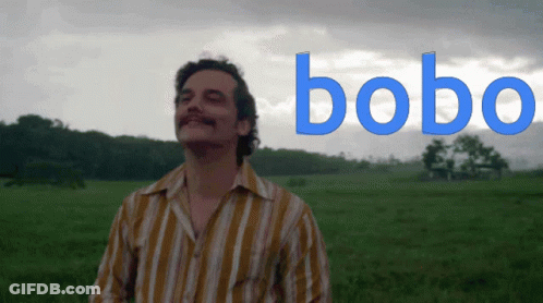 Man In Striped Shirt With Bobo In Field GIF