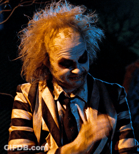 Man In Striped Suit Making A Face GIF