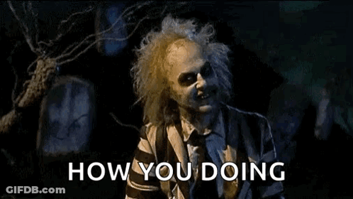 Man In Striped Suit Saying How You Doing At Cemetery GIF