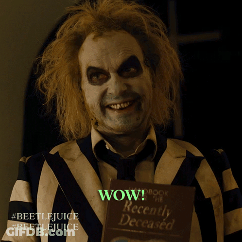 Man In Striped Suit Saying Wow GIF