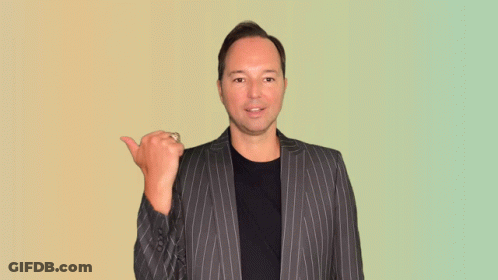 Man In Striped Suit Smiling And Pointing GIF