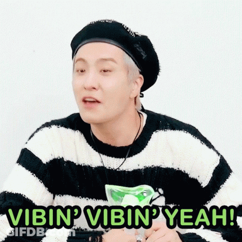 Man In Striped Sweater And Black Hat Saying Vibin Vibin Yeah GIF