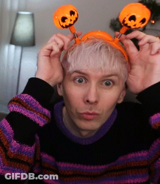 Man In Striped Sweater And Pumpkin Headband GIF