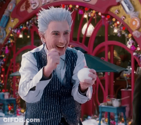 Man In Striped Vest Holding White Ball Smiling GIF
