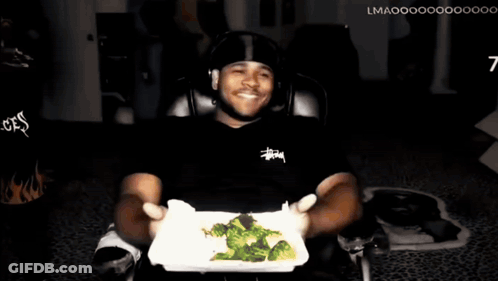 Man In Stussy Shirt Holding Broccoli Plate GIF