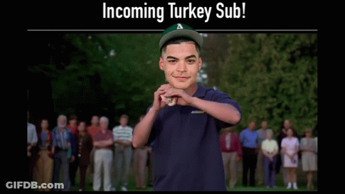 Man In Subway Shirt Holding Turkey Sub GIF