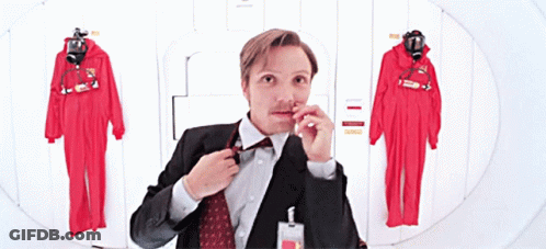 Man In Suit Adjusting Bow Tie GIF