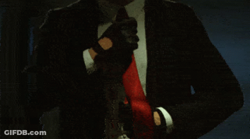 Man In Suit Adjusting Red Tie GIF