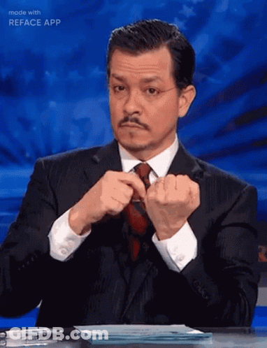 Man In Suit Adjusting Tie GIF