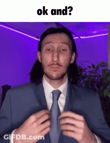 Man In Suit Adjusting Tie Saying OK And GIF