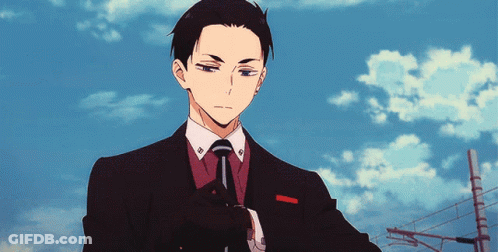 Man In Suit Adjusting Watch GIF