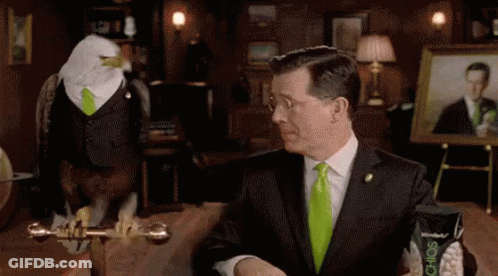 Man In Suit And Bald Eagle In Green Tie GIF