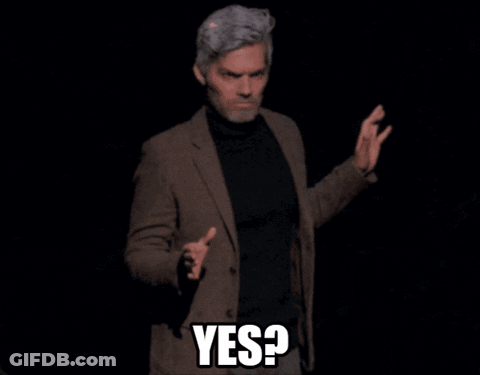 Man In Suit And Black Turtleneck Saying Yes GIF