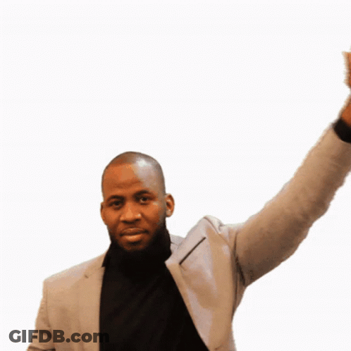 Man In Suit And Black Turtleneck Waving GIF