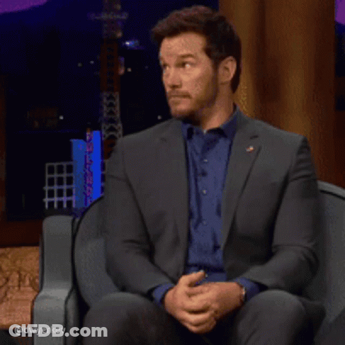 Man In Suit And Blue Shirt Laughing GIF
