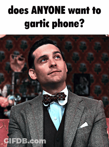 Man In Suit And Bow Tie Asks Does Anyone Want To Gartic Phone GIF