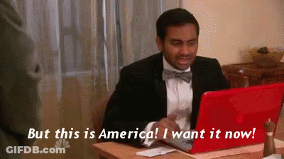 Man In Suit And Bow Tie At Red Laptop Saying But This Is America I Want It Now GIF