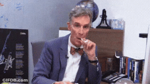 Man In Suit And Bow Tie Eating Food GIF
