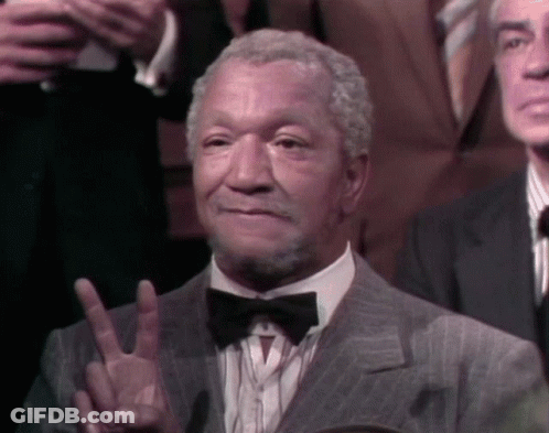 Man In Suit And Bow Tie Giving Peace Sign GIF
