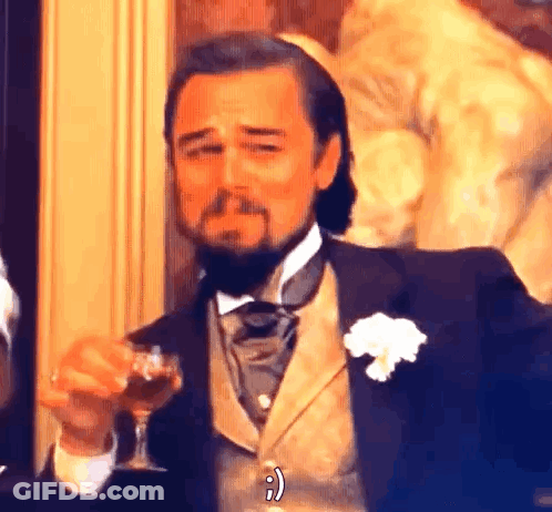 Man In Suit And Bow Tie Holding Wine Glass GIF