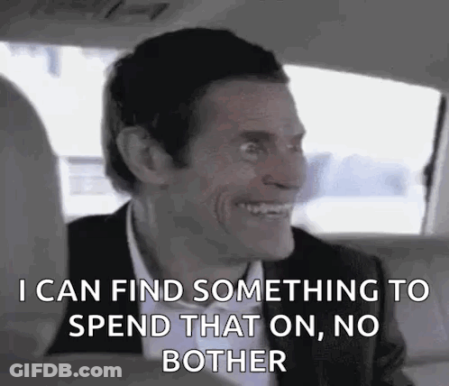 Man In Suit And Bow Tie In Back Seat GIF