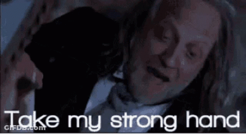 Man In Suit And Bow Tie Laying Down Saying Take My Strong Hand GIF