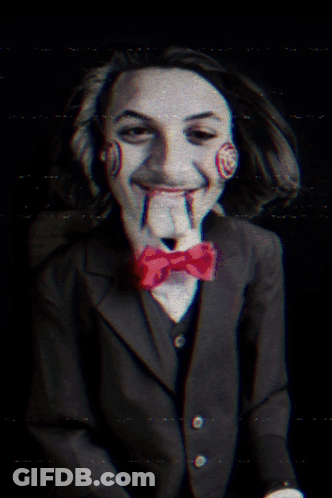 Man In Suit And Bow Tie Like Saw Puppet GIF