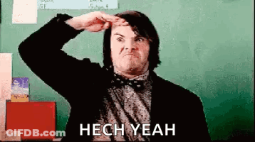 Man In Suit And Bow Tie Making Funny Face At Blackboard GIF