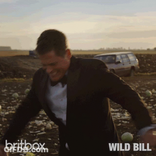 Man In Suit And Bow Tie Running Britbox Wild Bill GIF
