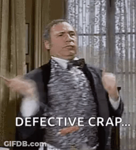 Man In Suit And Bow Tie Says Defective Crap GIF