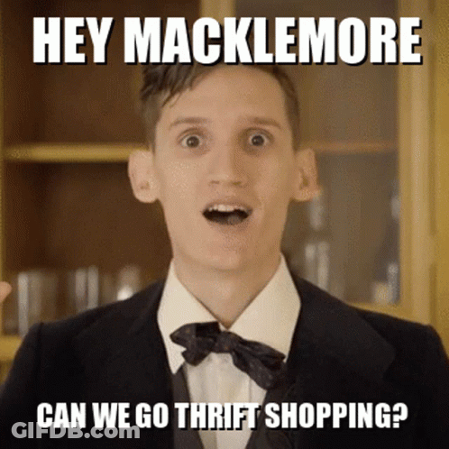 Man In Suit And Bow Tie Says Hey Macklemore GIF