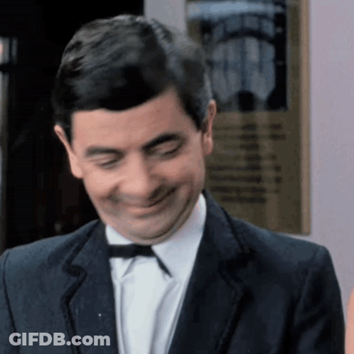 Man In Suit And Bow Tie Smiling GIF