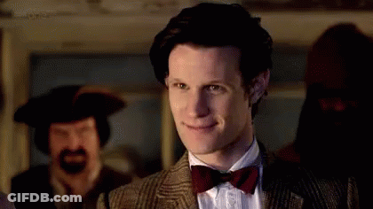 Man In Suit And Bow Tie Smiling GIF