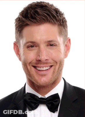 Man In Suit And Bow Tie Smiling GIF