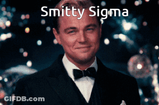 Man In Suit And Bow Tie Smiling With Smitten Sigma GIF