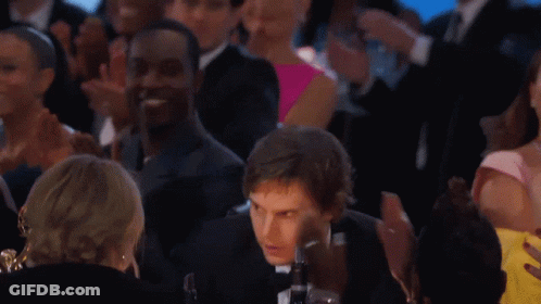 Man In Suit And Bow Tie Standing Before Crowd GIF