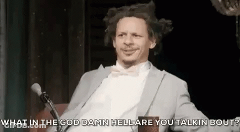 Man In Suit And Bow Tie Talking Into Microphone GIF