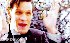 Man In Suit And Bow Tie Waving GIF