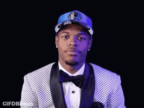 Man In Suit And Bow Tie With Dallas Mavericks Hat GIF