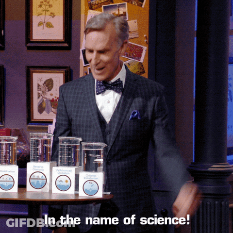 Man In Suit And Bow Tie With In The Name Of Science Boxes GIF