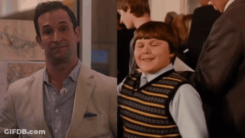 Man In Suit And Boy In Striped Vest GIF
