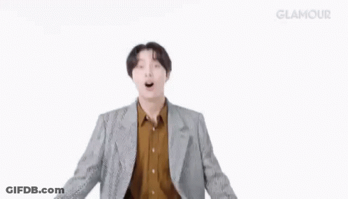 Man In Suit And Brown Shirt Dancing Arms Outstretched GIF